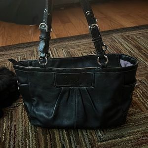 Vintage black Coach purse with light purple inside. very good condition